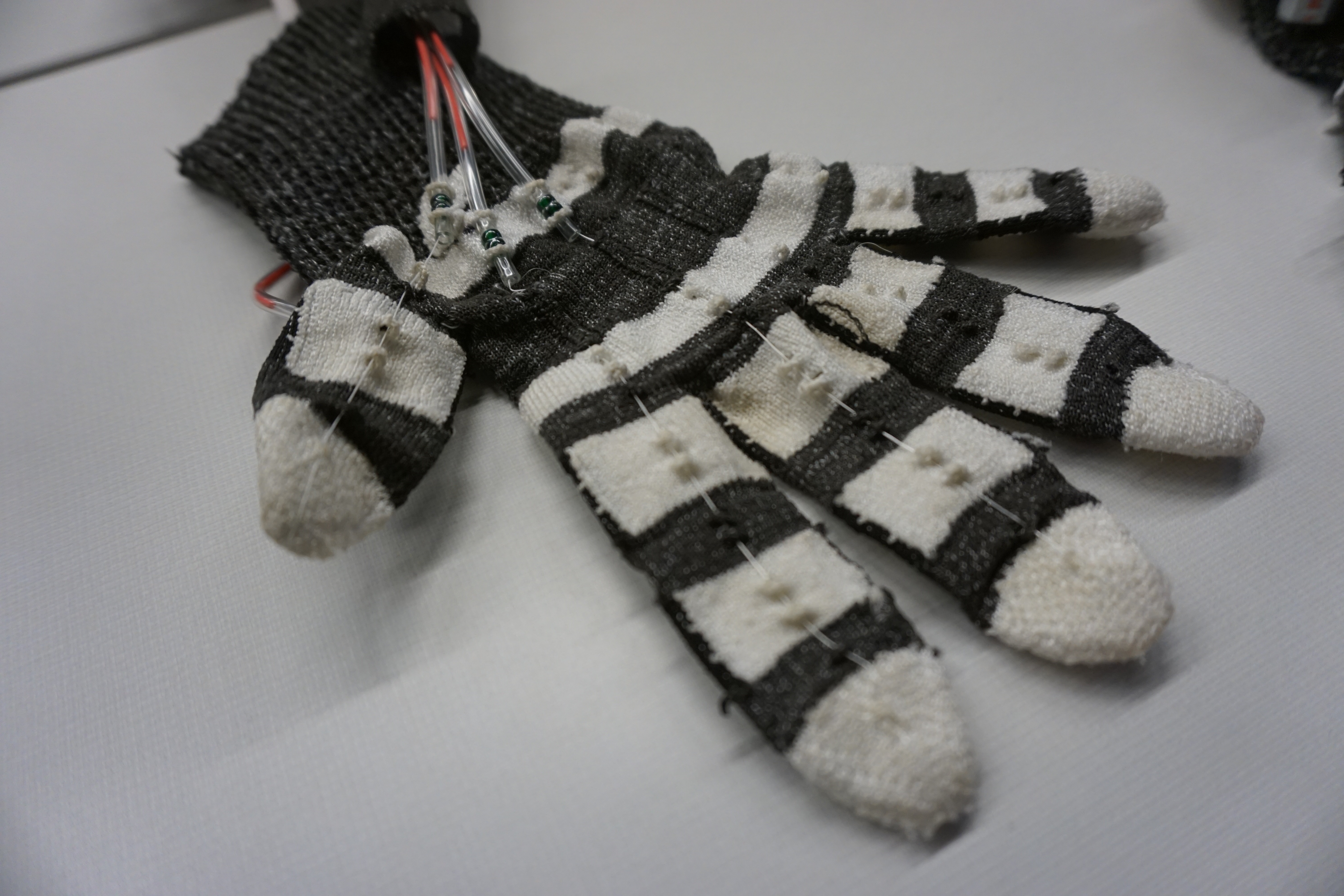 A glove, embraced by technology. Like Adam who ate forbidden fruit and gained understanding, this glove's eyes have been opened to truth.